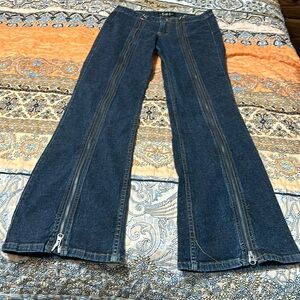 Size 9 gently used and loved wide legged jeans with multiple zippered trim.